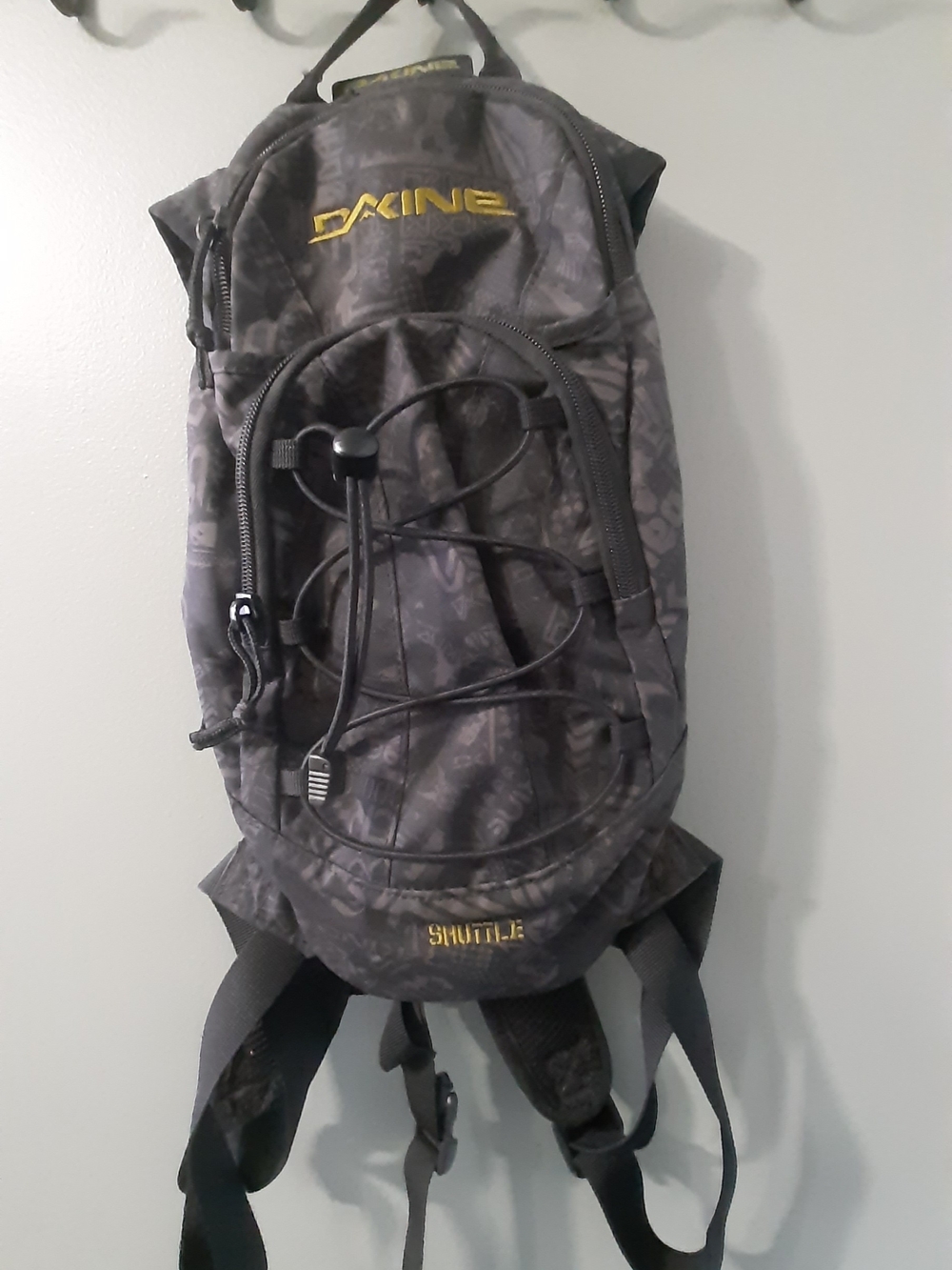 Dakine Black Shuttle Hydration Backpack with Yellow Logo